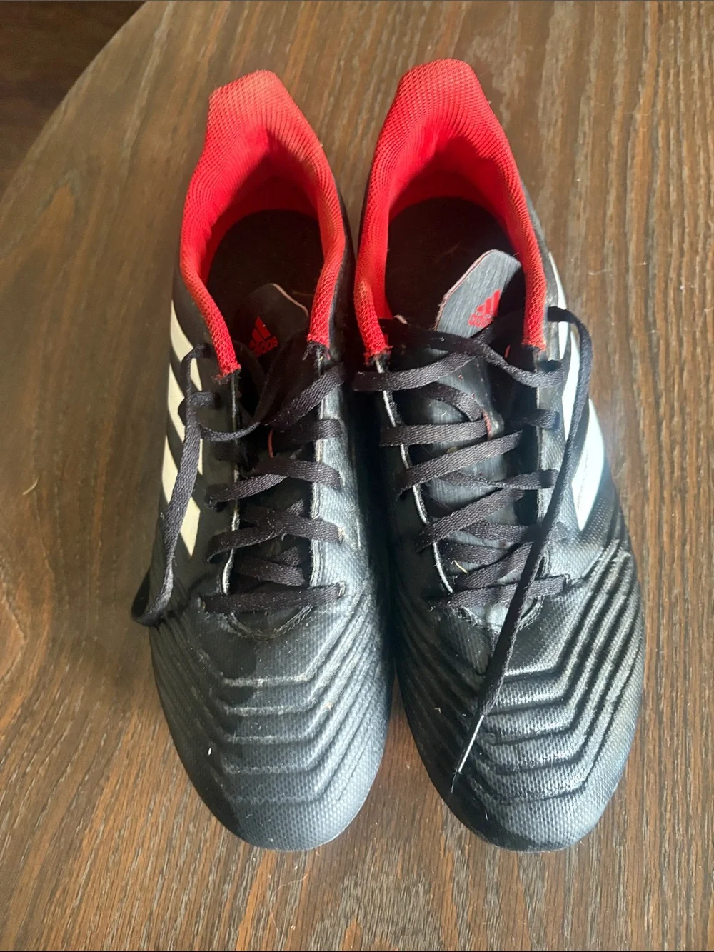 adidas Men’s Black Soccer Shoes with Red Lining and White Stripes
